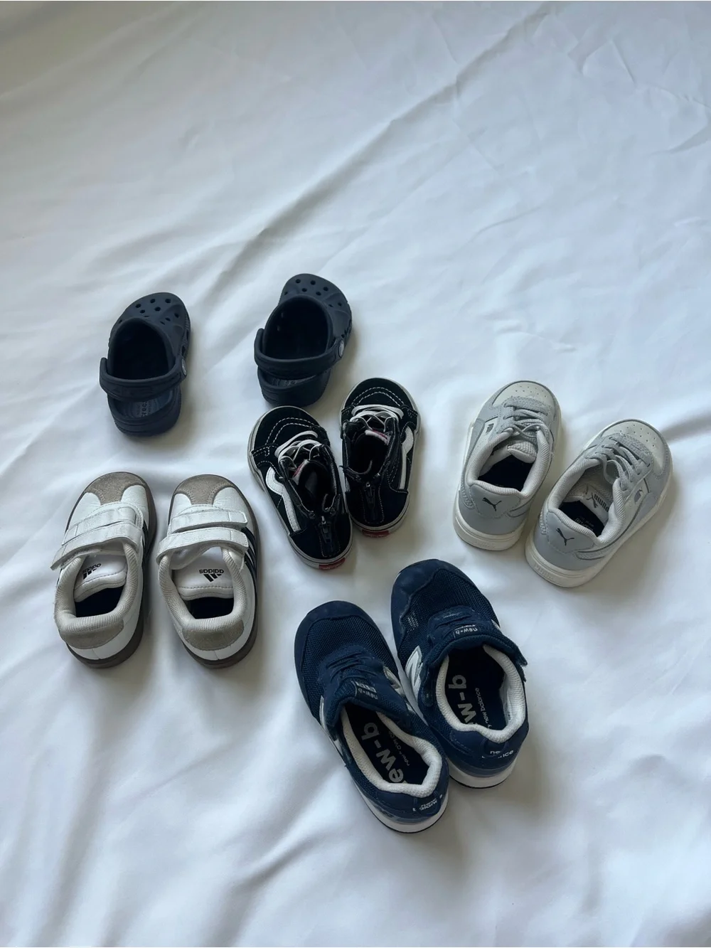 5 Pairs of Kids’ Shoes–Size 7– Different Brands.Crocs, Puma, vans, Adidas NB